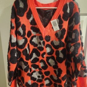 Torrid V-Neck Sweater in Orange and Black Leopard